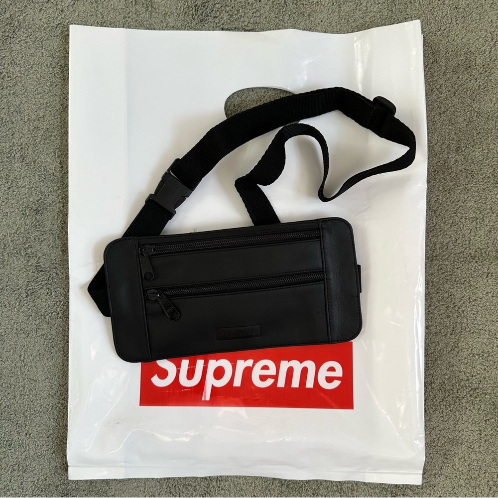 Supreme embossed leather shoulder bag/wallet